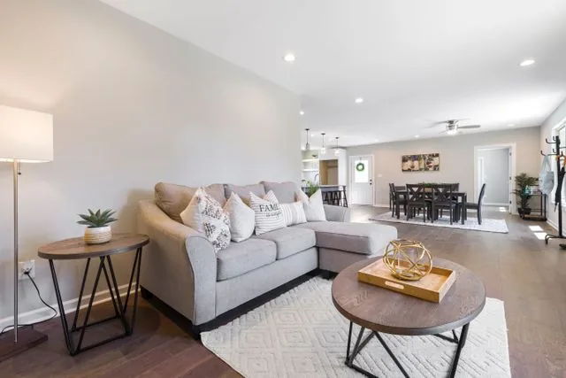 Living room with a grey L-shaped couch in a Tierrasanta rental home